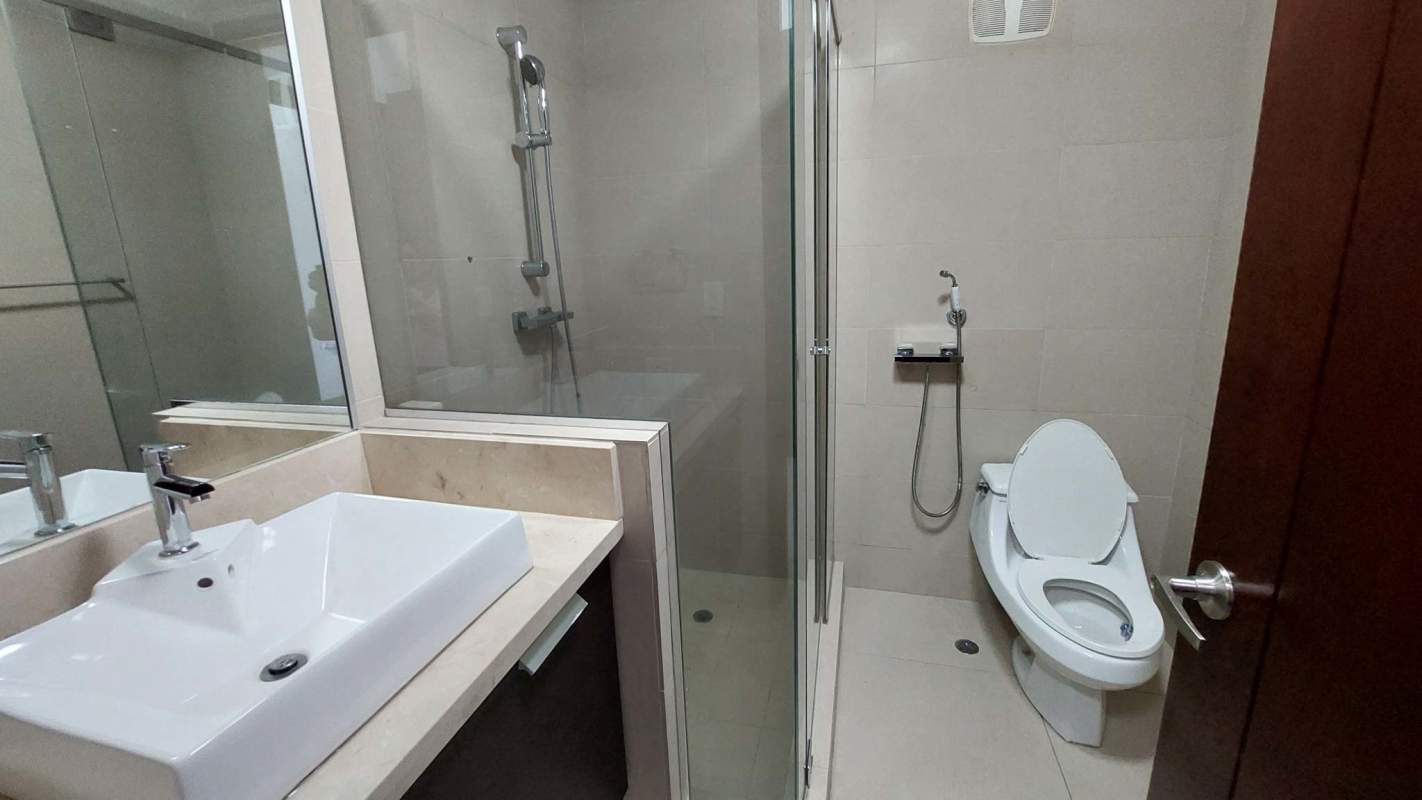 Contemporary bathroom with glass-enclosed shower and mosaic accents at PH Ocean Club Punta Pacifica
