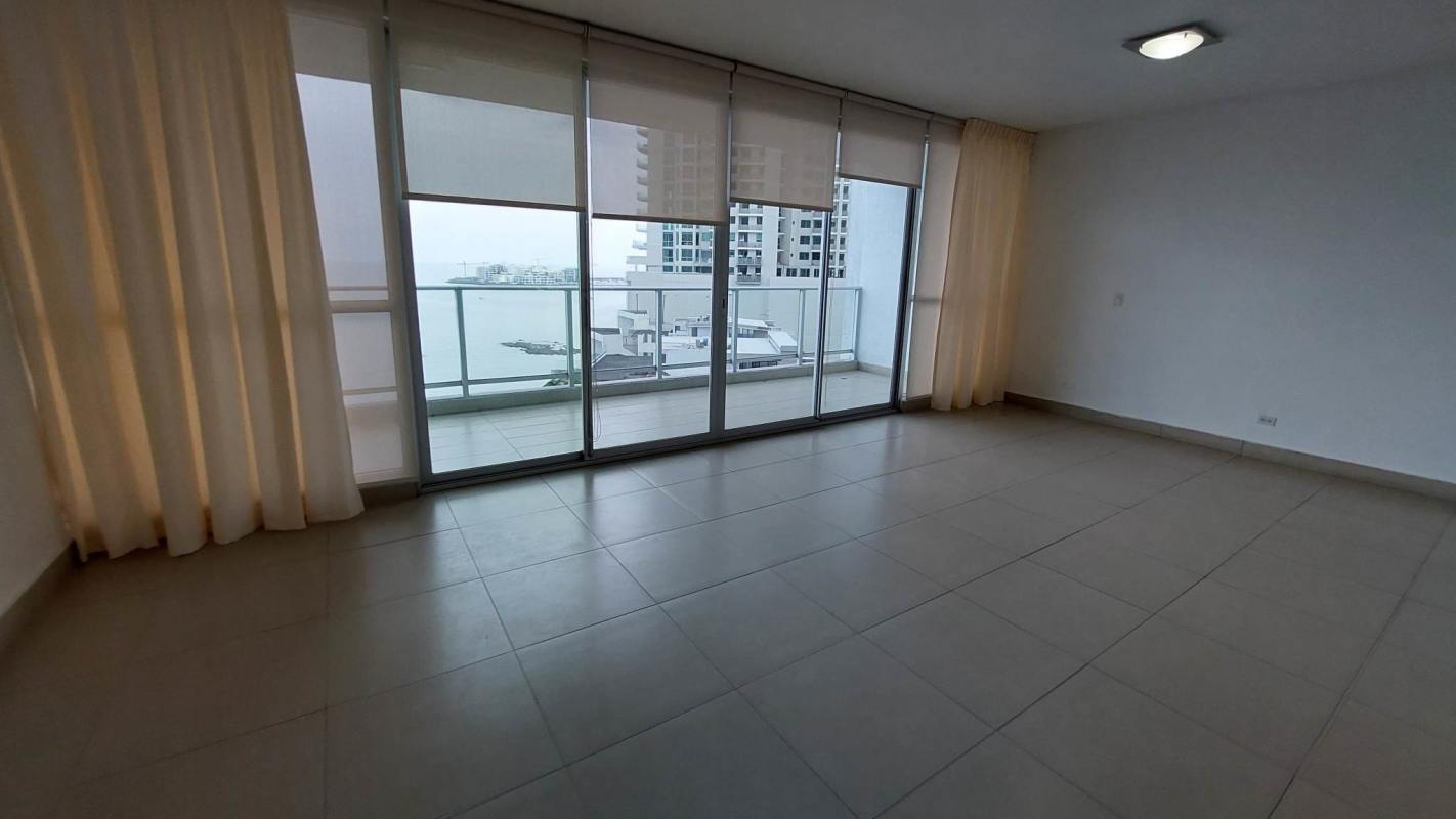 Master bedroom featuring large windows and panoramic Pacific Ocean view at PH Ocean Club Panama