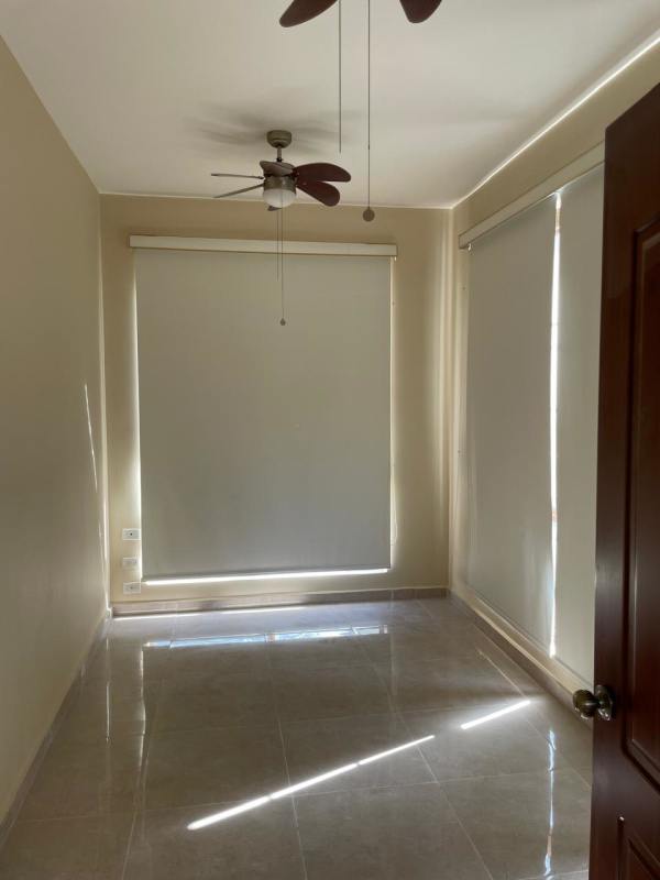Bright open living room with large windows and tiled floor in luxury house Clayton Panama