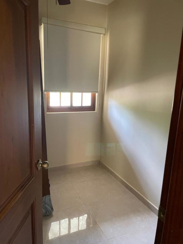 Large unfurnished bedroom with balcony access and natural light Clayton Panama rental