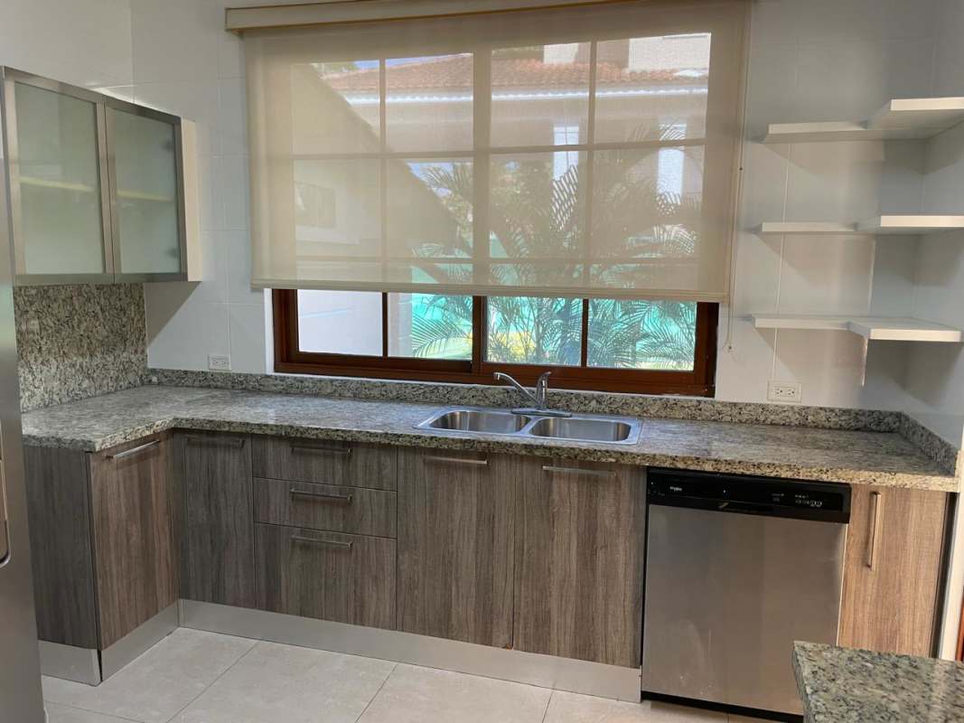 Private community swimming pool with sun deck and lounge chairs in Clayton Panama