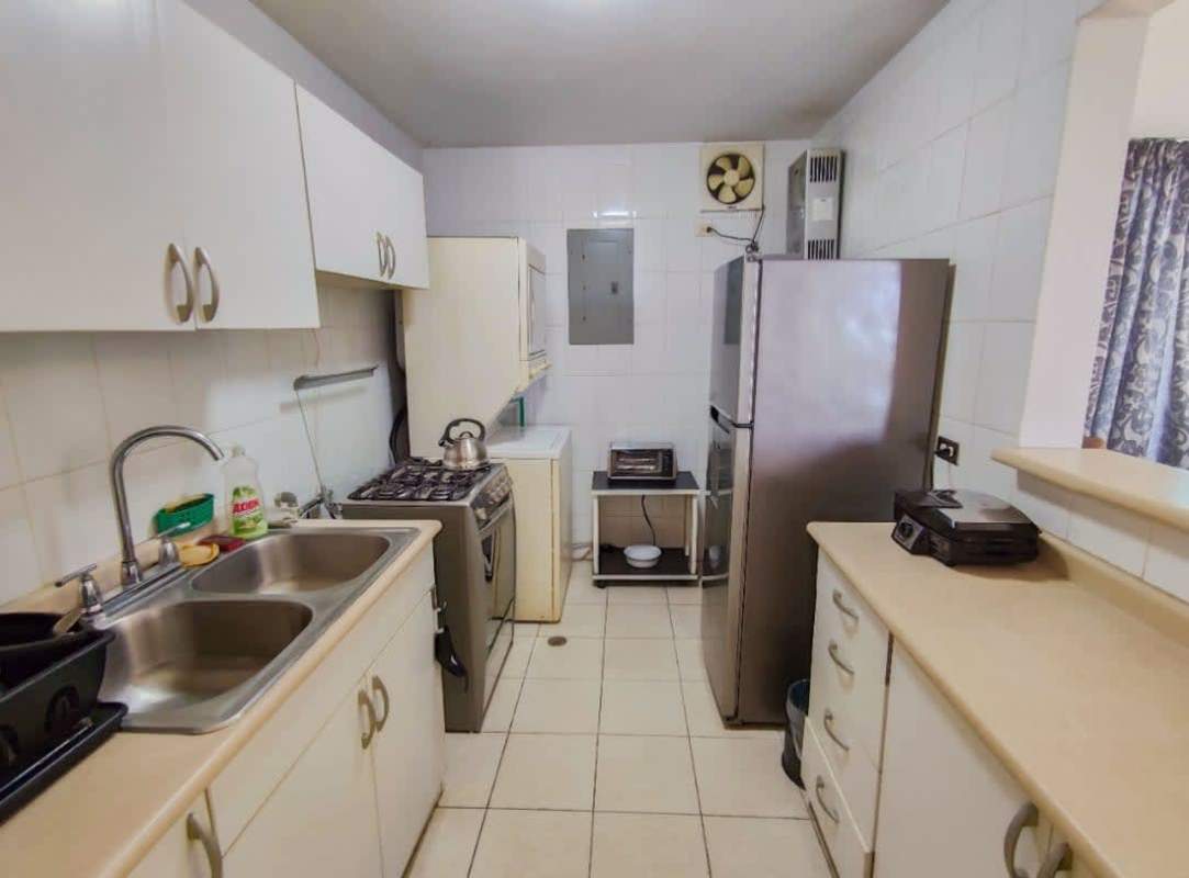 Modern tiled bathroom with glass shower enclosure in PH Edison Park Panama
