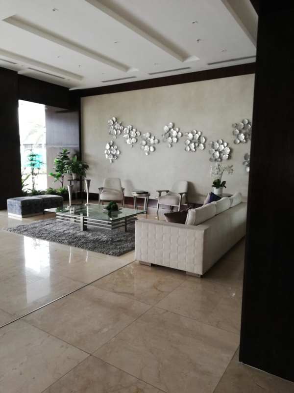 Luxury tower lobby with seating area marble floors at PH Mirador Costa del Este