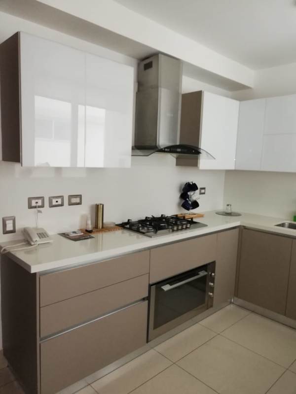 Furnished master bedroom with ocean view access balcony at PH Mirador Costa del Este Panama City