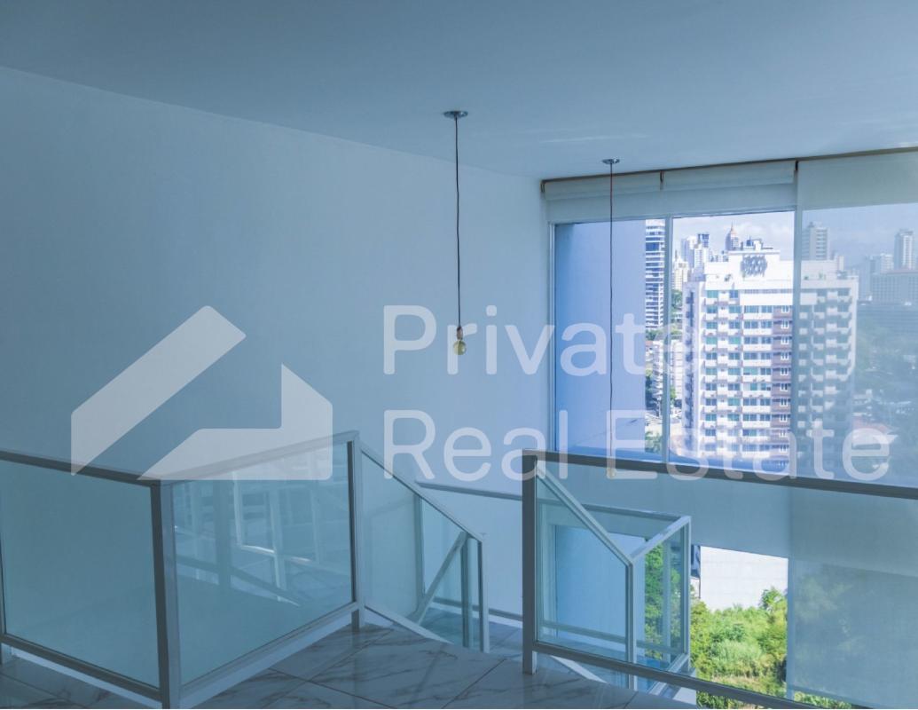 Open plan living and dining loft with mezzanine and large panoramic windows PH Blue Park Bella Vista Panama
