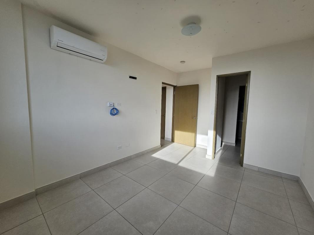 Bedroom with air conditioner, closet, tiled floors in PH Vista Horizonte Panama City