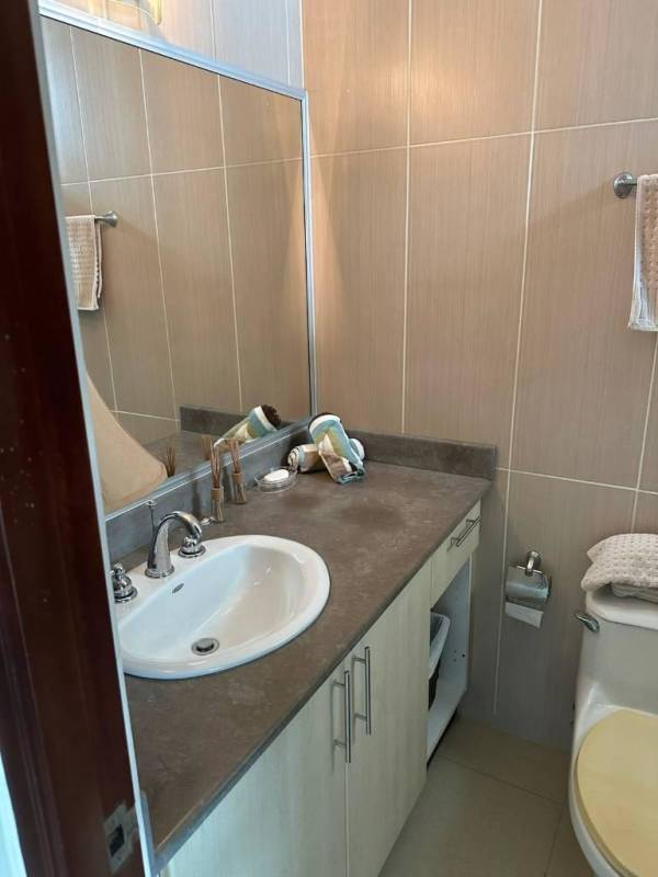 Contemporary bedroom with ceiling fan window coverings city view in PH Vista Park El Carmen Panama