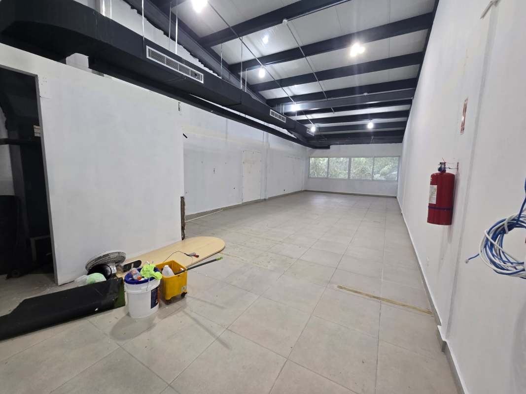Open commercial interior with industrial features and tiled floor Costa del Este Panama