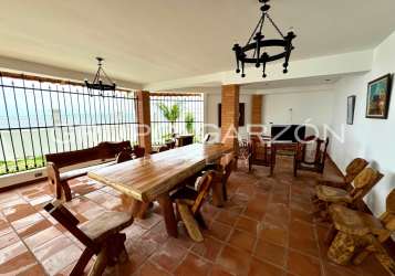 Spacious bedroom in beachfront Panama villa with large windows and terrace access