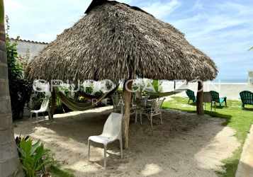 Architectural spiral staircase with chandelier centerpiece at Playa Blanca beachfront villa