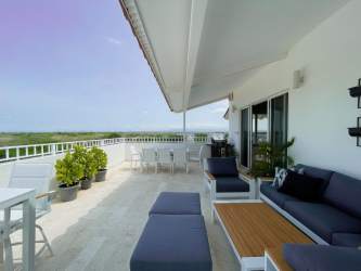 Tropical landscaped swimming pool area beachfront condo Buenaventura Panama