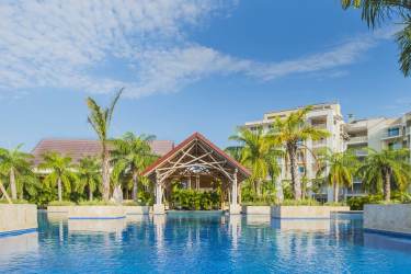 Aerial view luxury tropical resort beachfront condos palm trees pools Buenaventura Panama