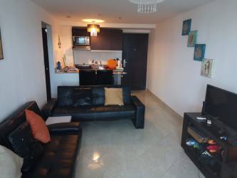 Bright living room opening to private ocean-view balcony PH Playa Corona beach condo