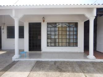 Front of single-family home with covered porch in La Alborada Colón Panama