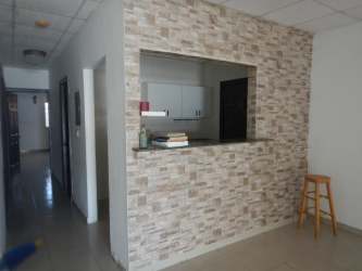 Minimalist kitchen with cabinets in house for sale Colón Panama