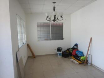Bright bedroom with wardrobe and barred windows in Colón Panama La Alborada