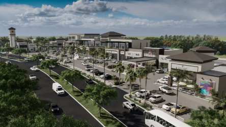 Shopping center with parking lot, multiple retail units, palm trees at Costa Verde La Chorrera
