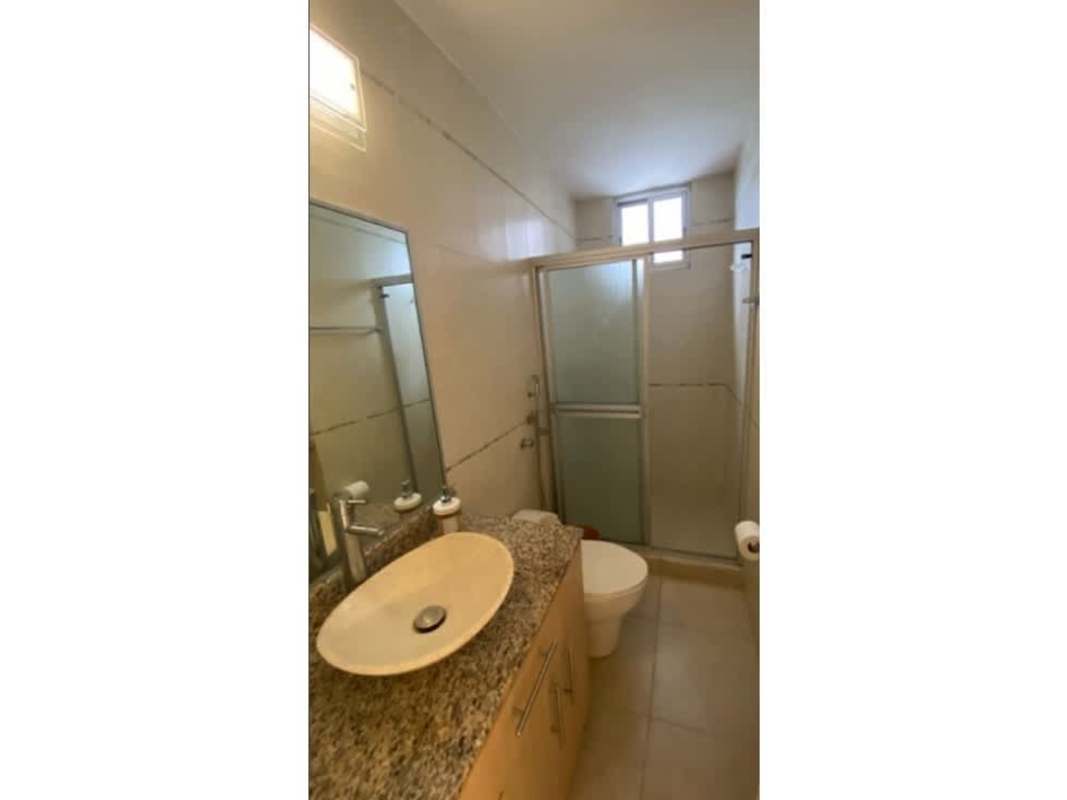 Bathroom with granite countertop and walk-in glass shower in PH Fairmont Plaza Panama