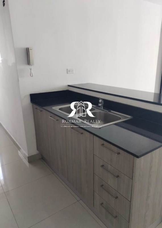 Kitchen area with granite counter stainless sink upper cabinets in PH Coral Towers Panama