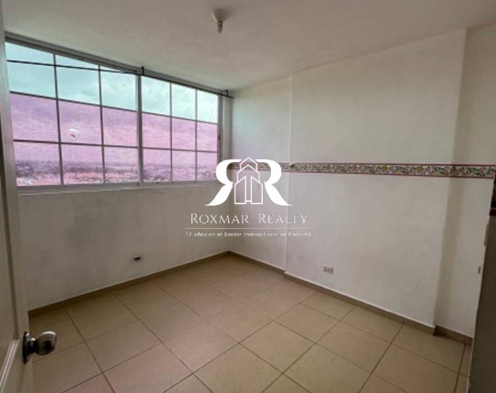 Bedroom with large window tiled flooring Mystic Hills Panama City affordable apartment