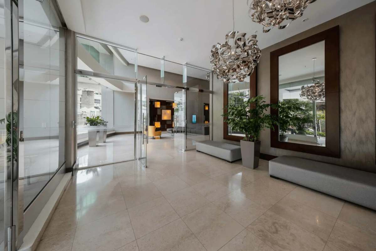 Elegant master bedroom with floor-to-ceiling windows, ocean view, luxury finishes at PH Allure Panama