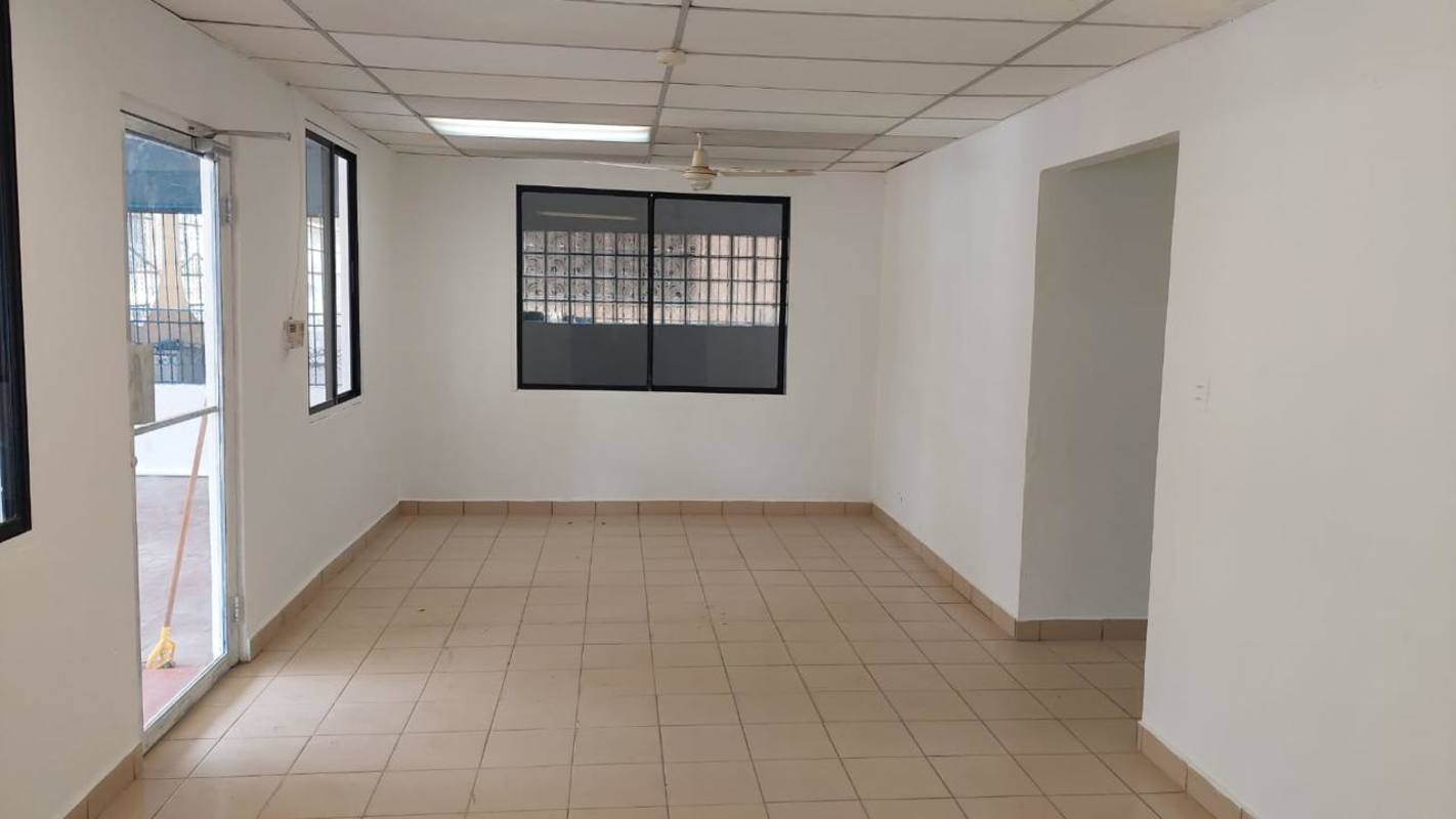 Empty interior room with tile floors, windows, ceiling tiles in commercial building San Miguelito Panama