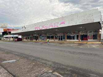 Commercial complex with canopy and multiple glass storefronts David Panama