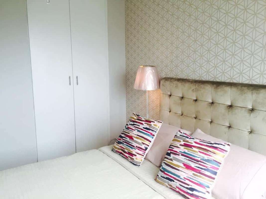 Minimalist dining or workspace area with large window and ceiling fan in PH Rim Tower Hato Pintado Panama City