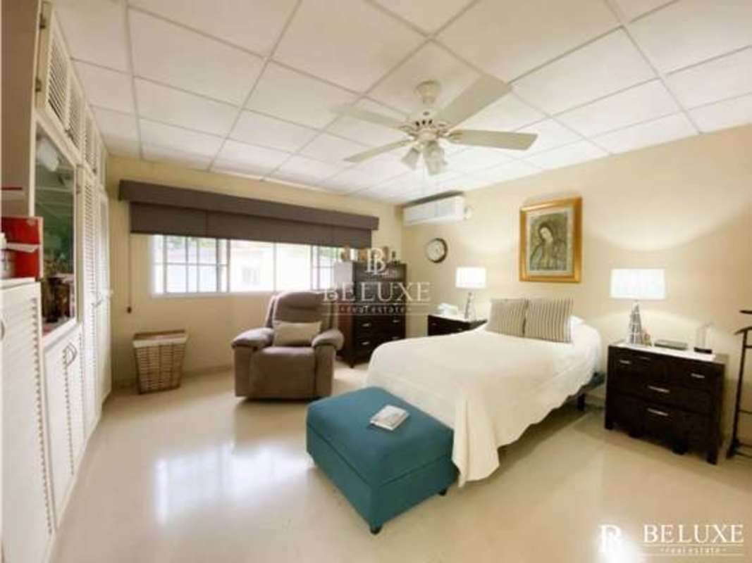 Master bedroom with window, ceiling fan, tile floors Bethania Panama house for sale