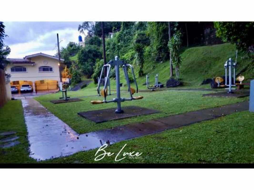 Green area with outdoor gym equipment landscaped in Bethania Panama gated community