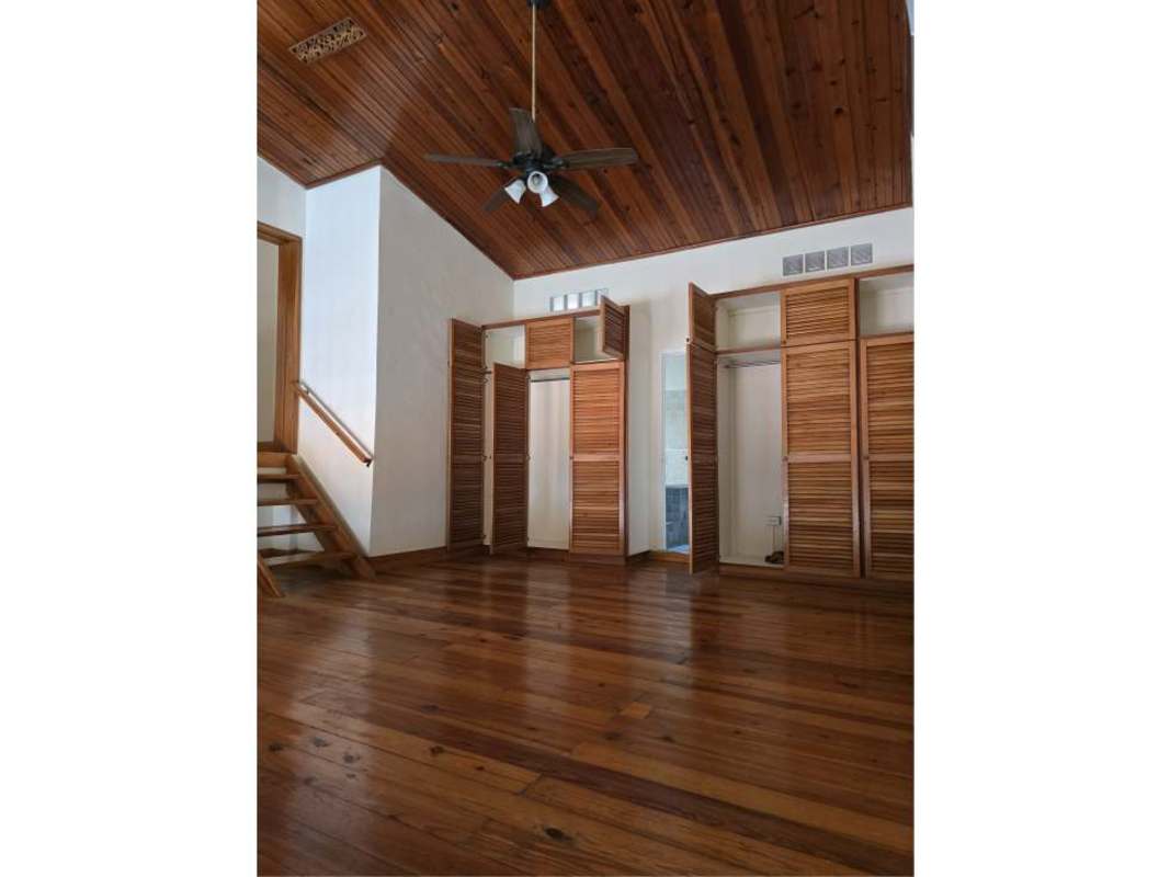 Bedroom featuring wood ceilings, wooden floors and built-in closets Casco Viejo penthouse Panama