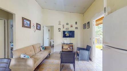 Covered bohio with BBQ next to pool lush patio Hacienda La Florenciana house Las Uvas Panama for sale