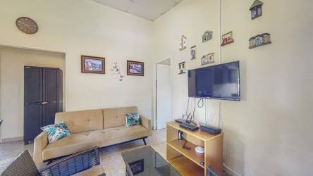 Spacious living room open layout with sofa TV Las Uvas Panama Hacienda La Florenciana house for sale