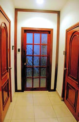 Hallway with multiple wood doors tile flooring Colon Free Zone Hotel Panama