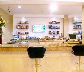 Reception desk with granite counters TV and lounge seating hotel investment Panama