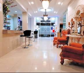 Reception area with chandeliers armchairs Colonial design hotel for sale Colon Free Zone Panama