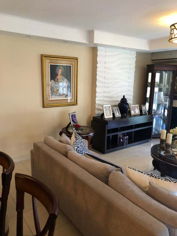 Formal dining room with stylish lighting and tile floors in PH El Cangrejo Tower