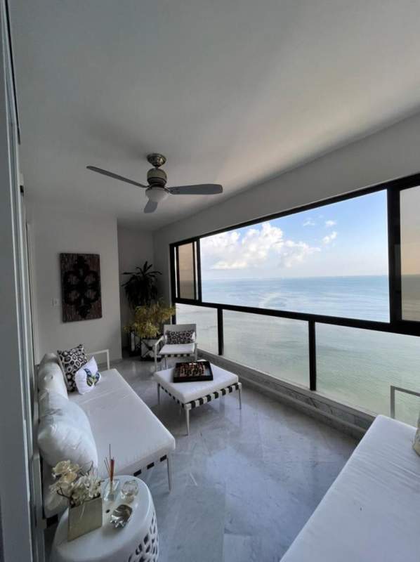 Aerial view of Punta Paitilla oceanfront with pools and high-rise towers Punta del Sol Panama City