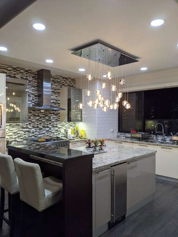 Luxury living room with waterfront views floor-to-ceiling windows PH Punta del Sol Panama