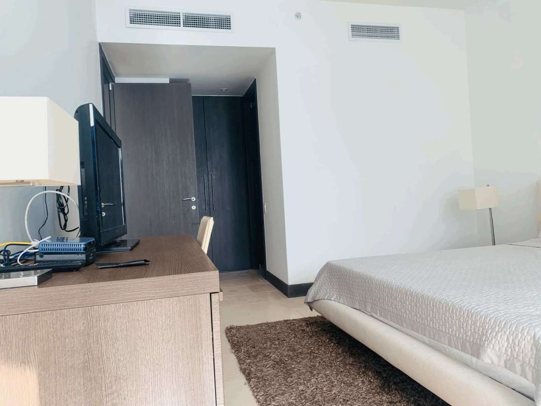 Elegant living room with modern furniture, open-plan at The Ocean Club Punta Pacifica luxury condominium