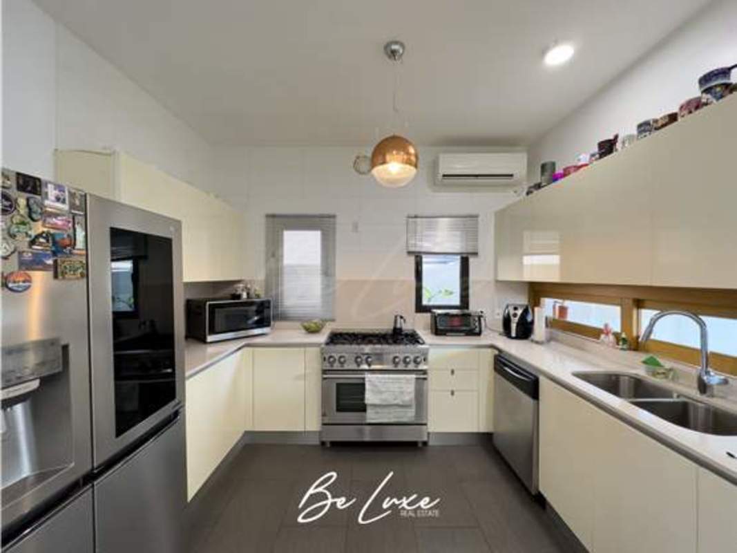 Spacious modern kitchen with stainless steel appliances in exclusive Altos de Panamá house for sale