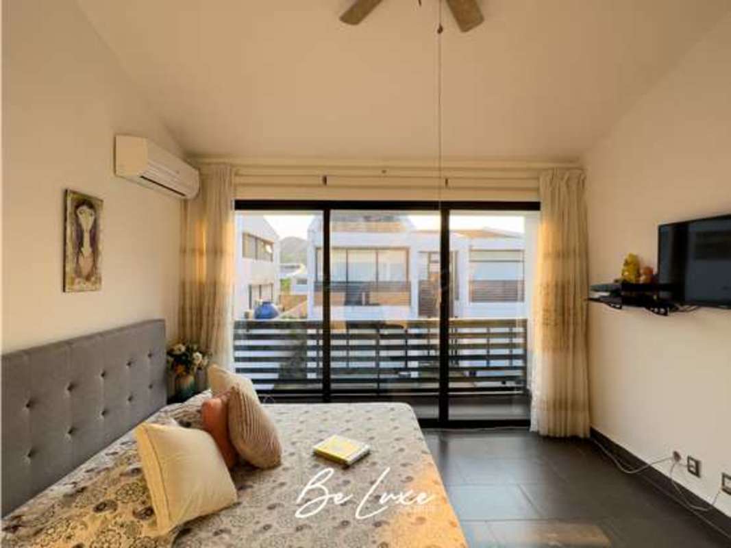 Bedroom in luxury home with balcony and large windows Condado del Rey Altos de Panamá