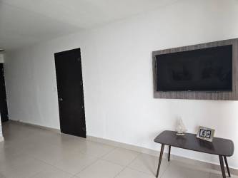 Beachfront lagoon with sandy beach and palms at Playa Blanca Resort Panama