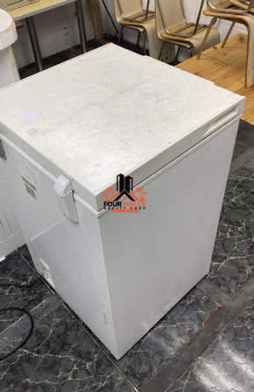 Utility room with chest freezer and chairs in commercial fonda Plaza Los Colores El Chorrillo Panama