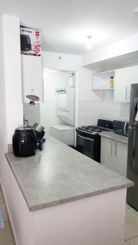 Living area with large window, tile flooring in PH Alegria apartment on Vía España Panama
