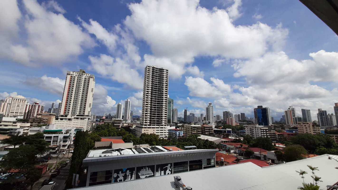 Secondary bedroom with built-in wardrobe and large window in PH Marfil Panama City