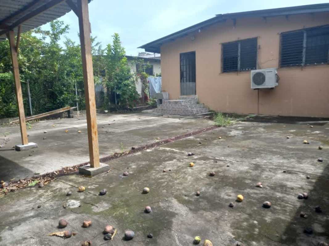 Spacious concrete backyard with air conditioning split unit and patio Villa Rica Panama