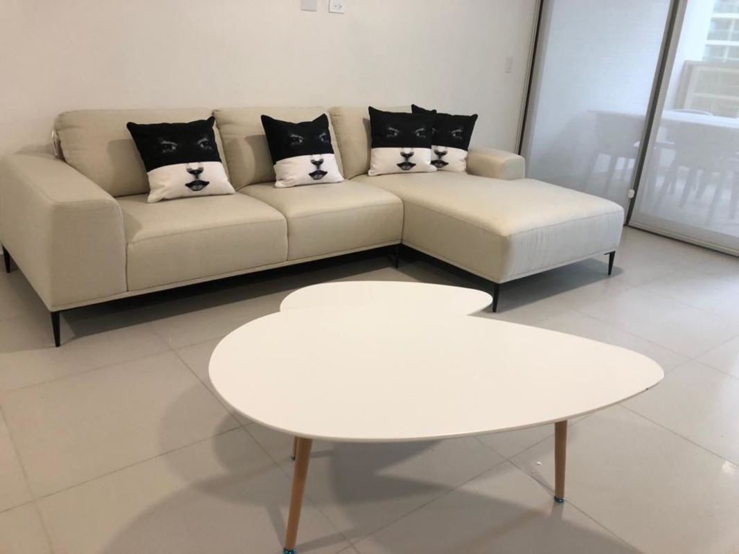 Upgraded modern kitchen with wood cabinets and stainless appliances in apartment Costa del Este