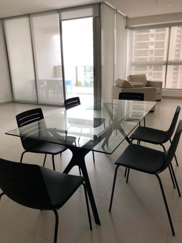 Bright open living dining space with balcony access in luxury Costa del Este apartment rental