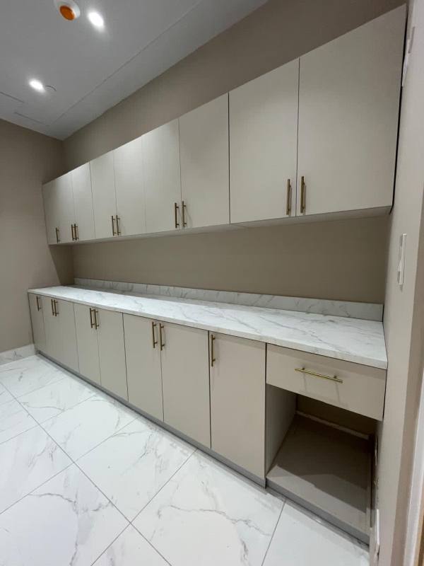 Compact kitchenette with marble countertop, storage cabinets in Town Center Costa del Este Panama